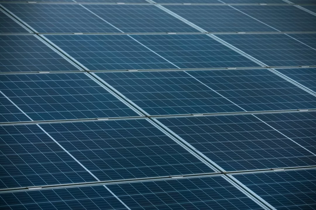 Rows of blue solar panels installed closely together in Portocolom, capturing sunlight for renewable energy and promoting sustainable living in eco-friendly villas.